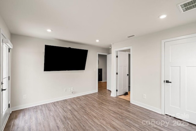 932 Portrush Ln, Tega Cay, SC 29708 - unfurnished bedroom featuring wood finished floors and recessed lighting