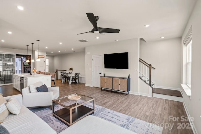 932 Portrush Ln, Tega Cay, SC 29708 - living room with dark wood-style floors, a ceiling fan, stairway, and recessed lighting