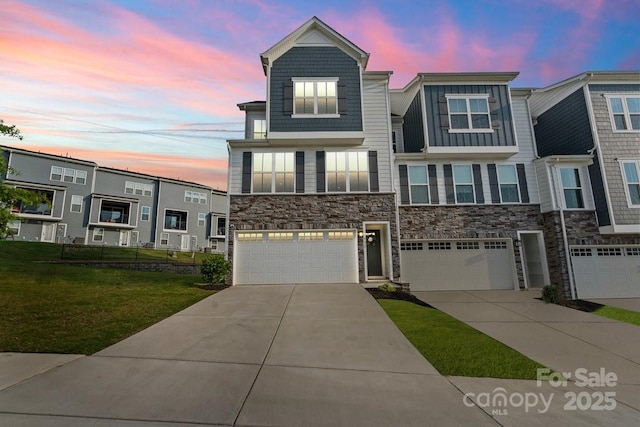 932 Portrush Ln, Tega Cay, SC 29708 - townhome / multi-family property featuring stone siding, driveway, a garage, and a front lawn
