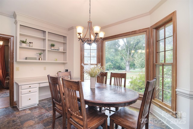 1482 Willow Oaks Trl, Matthews, NC 28104 - dining space with a chandelier, ornamental molding, dark stone finish floors, and built in desk