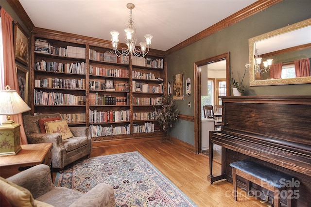 1482 Willow Oaks Trl, Matthews, NC 28104 - living area featuring a chandelier, wood finished floors, and crown molding