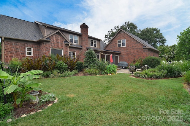 1482 Willow Oaks Trl, Matthews, NC 28104 - back of property featuring brick siding, a yard, a chimney, a patio area, and roof with shingles