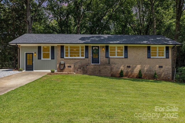 1948 Marett Blvd, Rock Hill, SC 29732 - view of front facade with a front yard, crawl space, brick siding, and driveway
