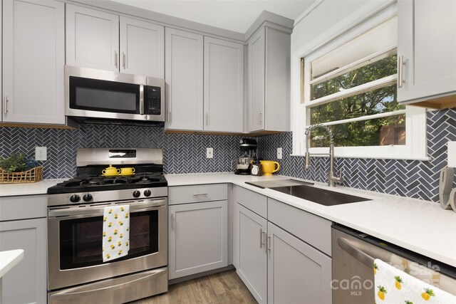 1948 Marett Blvd, Rock Hill, SC 29732 - kitchen featuring appliances with stainless steel finishes, light countertops, backsplash, and light wood finished floors