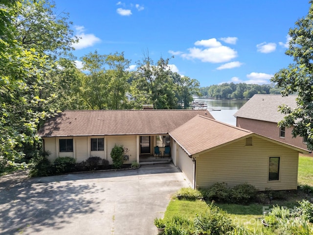 840 Deer Lake Run, Salisbury, NC 28146 - single story home featuring concrete driveway, a water view, a garage, and roof with shingles