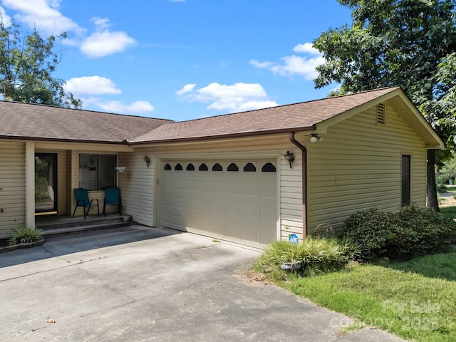 840 Deer Lake Run, Salisbury, NC 28146 - ranch-style home with an attached garage, a shingled roof, concrete driveway, and a porch