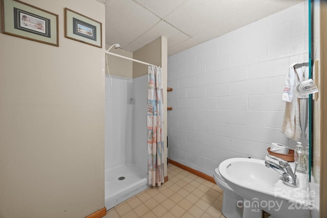 840 Deer Lake Run, Salisbury, NC 28146 - bathroom with a shower stall, a paneled ceiling, and concrete block wall