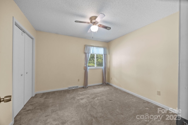 840 Deer Lake Run, Salisbury, NC 28146 - unfurnished bedroom featuring a textured ceiling, carpet, a closet, and a ceiling fan