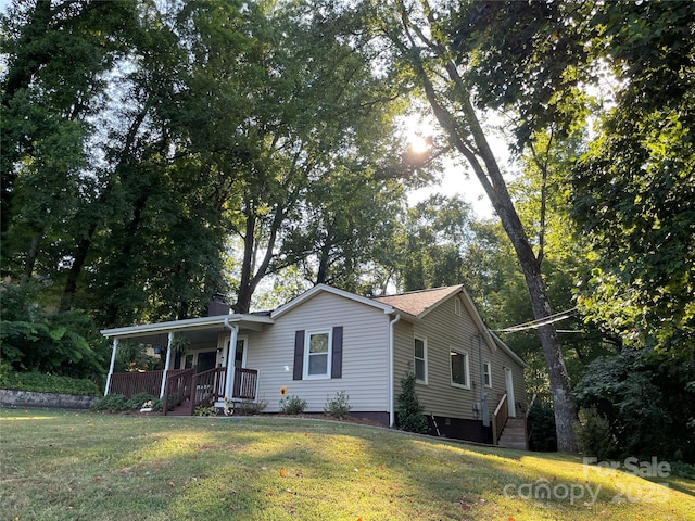 517 Stowe Dr, Lowell, NC 28098 - view of front of home featuring a front lawn, a porch, and a chimney