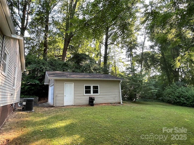 517 Stowe Dr, Lowell, NC 28098 - view of grassy yard featuring an outdoor structure and a garage
