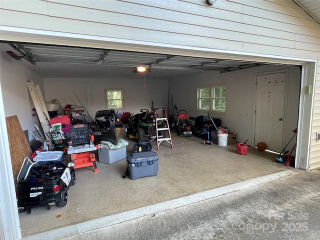 517 Stowe Dr, Lowell, NC 28098 - garage featuring a garage door opener