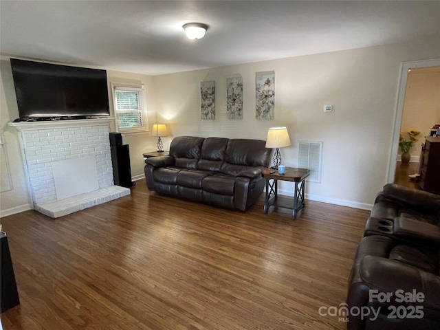 517 Stowe Dr, Lowell, NC 28098 - living area featuring wood finished floors and a fireplace