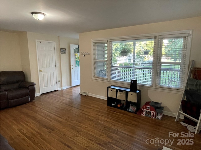517 Stowe Dr, Lowell, NC 28098 - living area with wood finished floors and baseboards