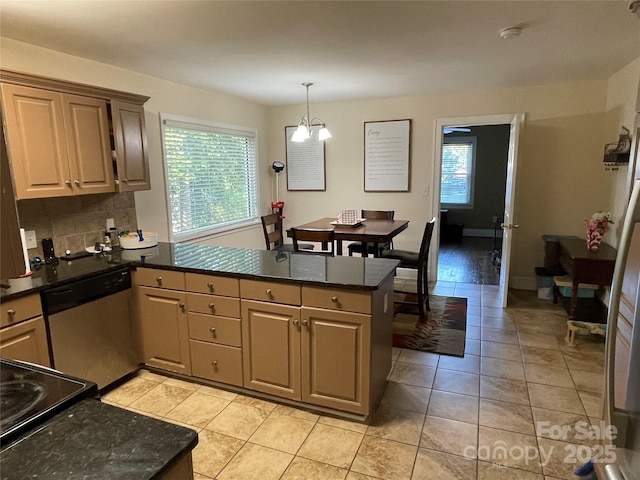 517 Stowe Dr, Lowell, NC 28098 - kitchen with stainless steel dishwasher, a peninsula, decorative backsplash, hanging light fixtures, and a chandelier