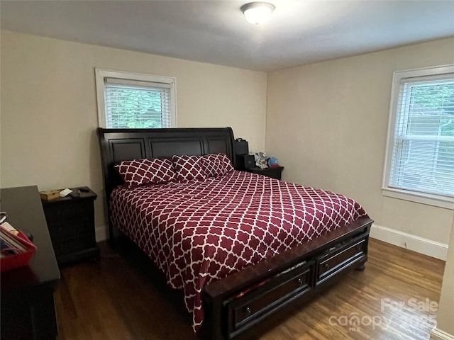 517 Stowe Dr, Lowell, NC 28098 - bedroom with dark wood-style flooring and baseboards