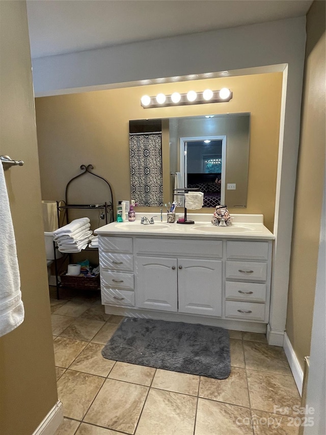 517 Stowe Dr, Lowell, NC 28098 - bathroom with double vanity and tile patterned floors