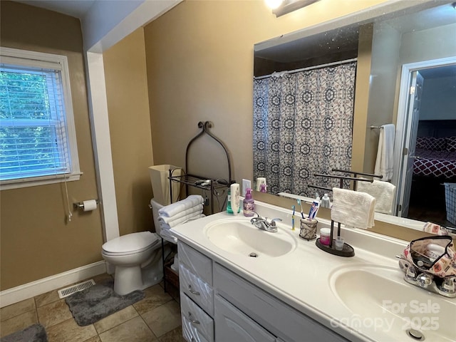 517 Stowe Dr, Lowell, NC 28098 - bathroom with double vanity and tile patterned floors