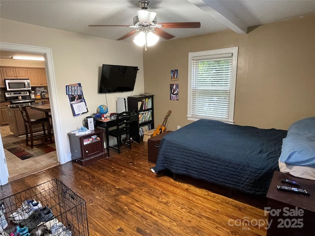 517 Stowe Dr, Lowell, NC 28098 - bedroom with wood finished floors, a ceiling fan, and beamed ceiling