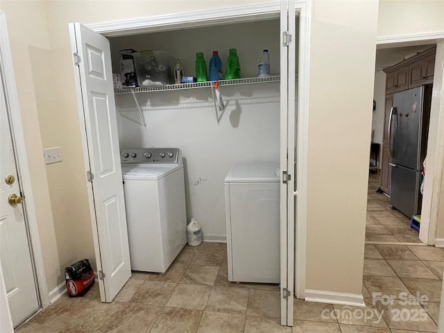 517 Stowe Dr, Lowell, NC 28098 - laundry area with separate washer and dryer and light tile patterned flooring