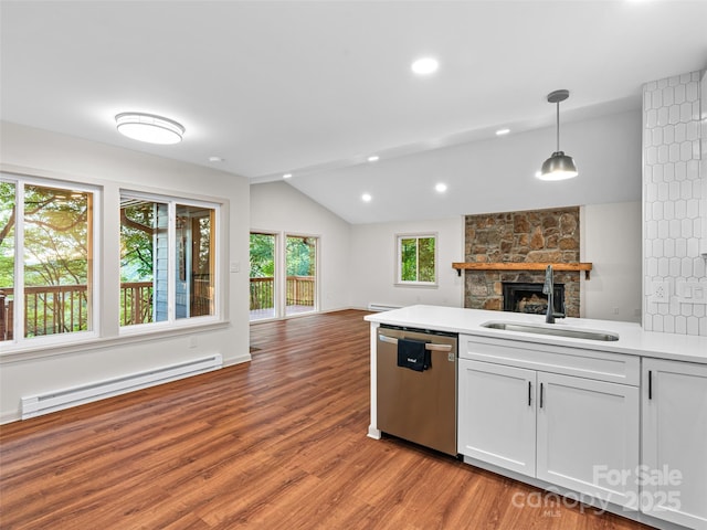 1065 Oak Ridge Ln, Mars Hill, NC 28754 - kitchen with a baseboard heating unit, dishwasher, open floor plan, a fireplace, and lofted ceiling