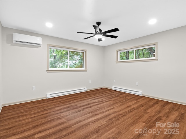 1065 Oak Ridge Ln, Mars Hill, NC 28754 - unfurnished room featuring baseboard heating, a wall mounted AC, healthy amount of natural light, and recessed lighting
