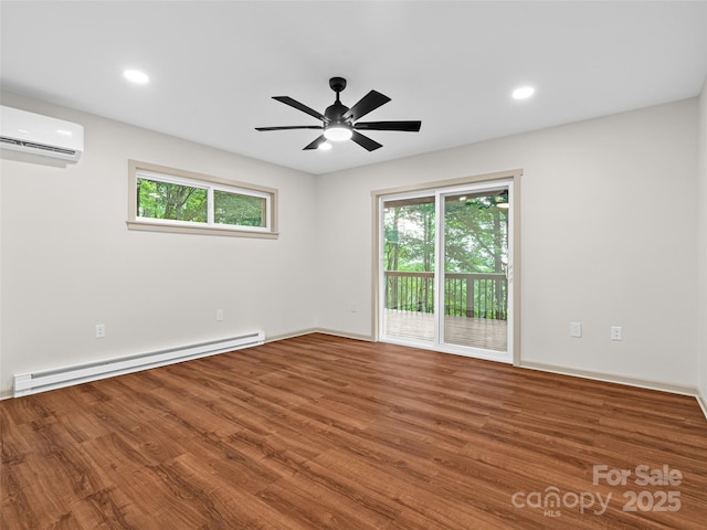 1065 Oak Ridge Ln, Mars Hill, NC 28754 - empty room with a wall mounted air conditioner, a baseboard heating unit, healthy amount of natural light, wood finished floors, and recessed lighting