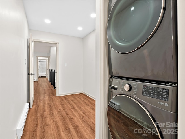1065 Oak Ridge Ln, Mars Hill, NC 28754 - laundry room featuring estacked washer and dryer, wood finished floors, and recessed lighting