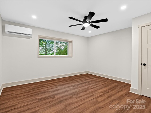 1065 Oak Ridge Ln, Mars Hill, NC 28754 - spare room featuring a wall mounted AC, wood finished floors, recessed lighting, and a ceiling fan
