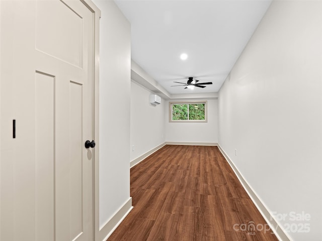 1065 Oak Ridge Ln, Mars Hill, NC 28754 - unfurnished bedroom with a wall unit AC, dark wood-type flooring, and a ceiling fan