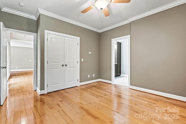 3450 4th Street Blvd NW, Hickory, NC 28601 - unfurnished bedroom with light wood-style flooring, ornamental molding, a ceiling fan, and a closet