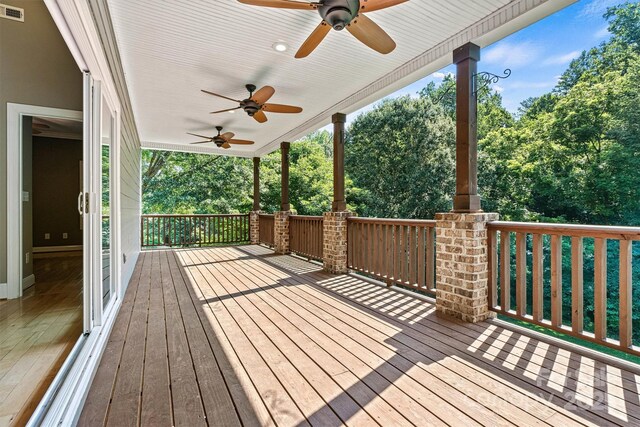 3450 4th Street Blvd NW, Hickory, NC 28601 - porch featuring ceiling fan and view of wooded area