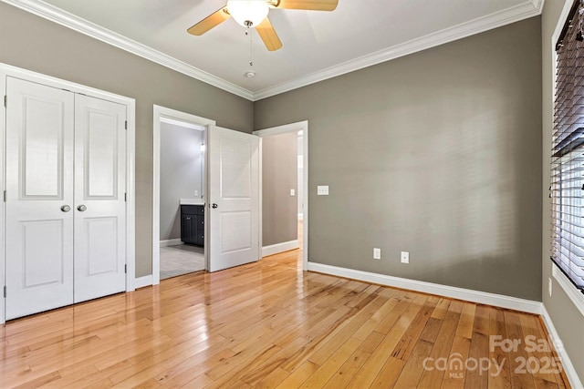3450 4th Street Blvd NW, Hickory, NC 28601 - unfurnished bedroom with crown molding, light wood-style floors, ceiling fan, and a closet