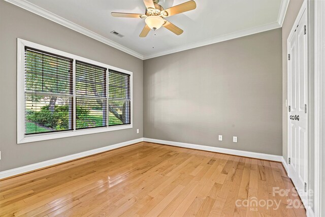 3450 4th Street Blvd NW, Hickory, NC 28601 - spare room with light wood-style flooring, crown molding, and ceiling fan