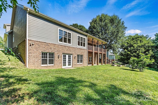 3450 4th Street Blvd NW, Hickory, NC 28601 - back of house featuring french doors, brick siding, a ceiling fan, and a yard