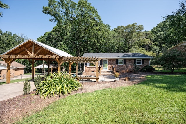 418 Stokes Ave, Clover, SC 29710 - back of property featuring a lawn, a pergola, a carport, and brick siding
