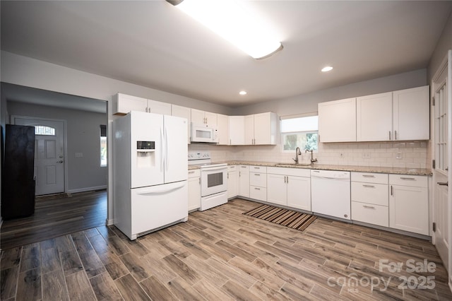 418 Stokes Ave, Clover, SC 29710 - kitchen featuring white appliances, tasteful backsplash, white cabinetry, wood finished floors, and recessed lighting