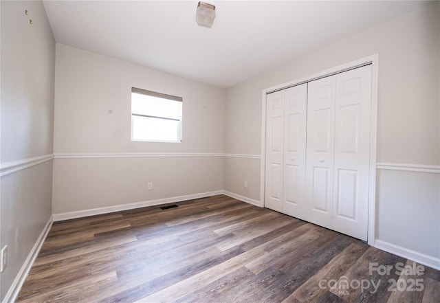 418 Stokes Ave, Clover, SC 29710 - unfurnished bedroom with wood finished floors and a closet
