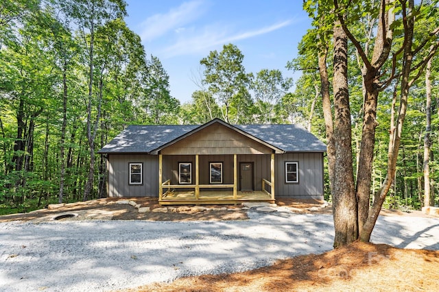 939 Rocky Mountain Rd, Lake Toxaway, NC 28747 - rustic home with a porch, roof with shingles, and driveway