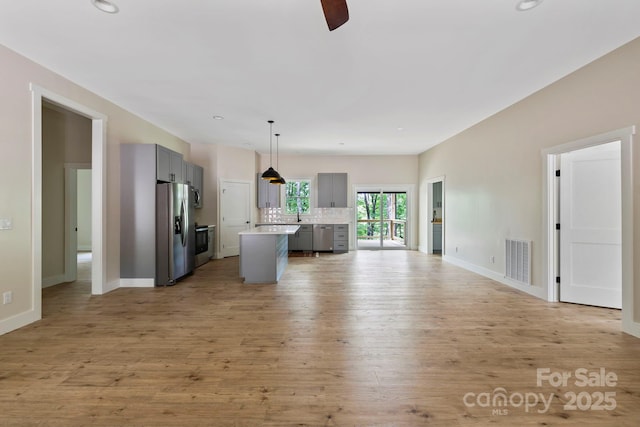939 Rocky Mountain Rd, Lake Toxaway, NC 28747 - unfurnished living room featuring light wood-type flooring, ceiling fan, and recessed lighting