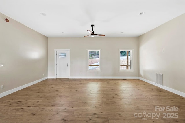 939 Rocky Mountain Rd, Lake Toxaway, NC 28747 - unfurnished living room with a ceiling fan, wood finished floors, and recessed lighting