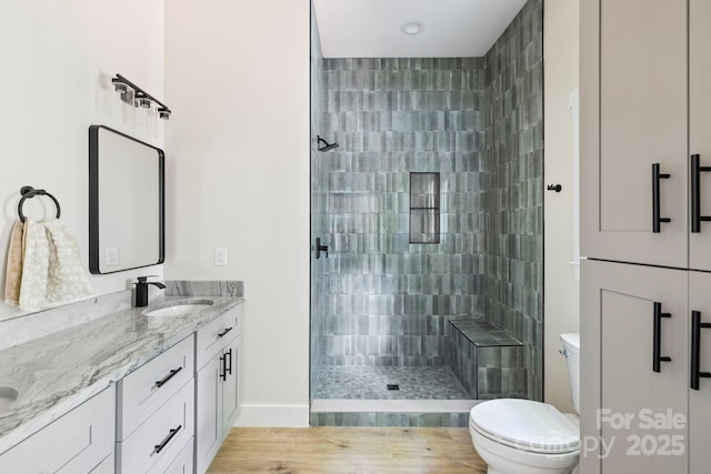 939 Rocky Mountain Rd, Lake Toxaway, NC 28747 - bathroom featuring a stall shower, double vanity, and wood finished floors