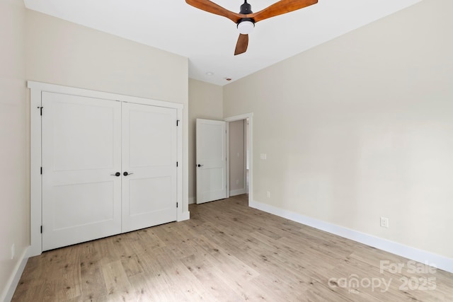 939 Rocky Mountain Rd, Lake Toxaway, NC 28747 - unfurnished bedroom featuring wood finished floors, a closet, and a ceiling fan