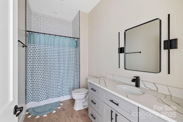 939 Rocky Mountain Rd, Lake Toxaway, NC 28747 - full bathroom with vanity, wood finished floors, and curtained shower