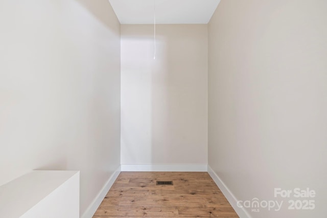 939 Rocky Mountain Rd, Lake Toxaway, NC 28747 - spare room with light wood finished floors and attic access
