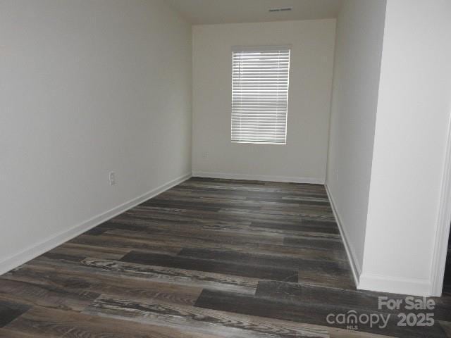 248 Mills Ave, Troutman, NC 28166 - unfurnished room featuring dark wood finished floors and baseboards