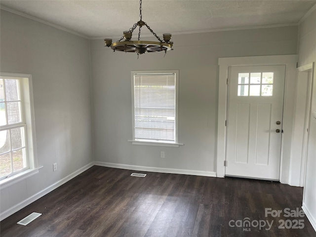 518 W White St, Chester, SC 29706 - entryway with a chandelier, ornamental molding, and dark wood finished floors