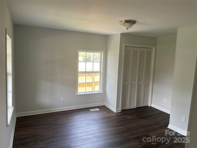 518 W White St, Chester, SC 29706 - unfurnished bedroom featuring dark wood finished floors and a closet