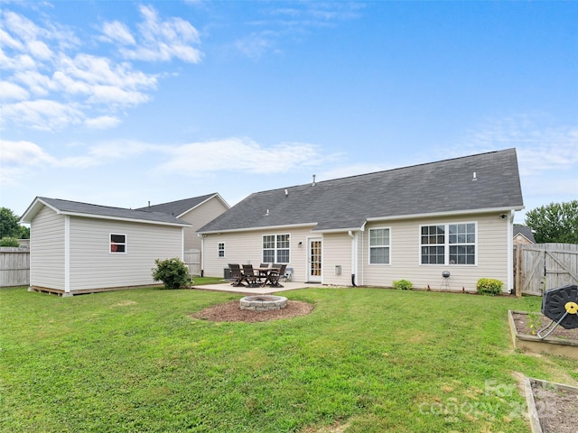 144 Haw River Rd, Fletcher, NC 28732 - rear view of house featuring a fenced backyard, an outbuilding, and a patio area