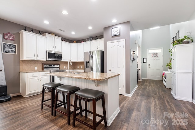 217 Fielding St, Mount Holly, NC 28120 - kitchen featuring stainless steel appliances, white cabinets, dark wood finished floors, and recessed lighting