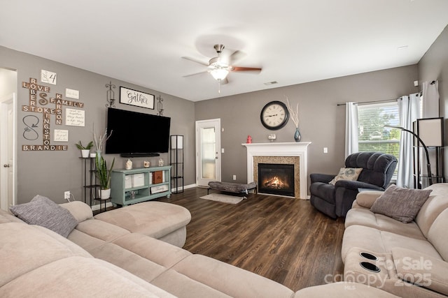 217 Fielding St, Mount Holly, NC 28120 - living room with dark wood-style flooring, ceiling fan, and a glass covered fireplace